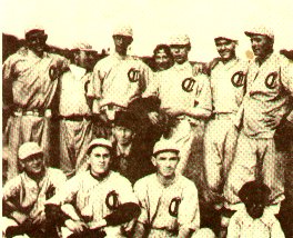 Taken in 1916 on what is now known as the Delaware Community Center field. Right to left, Front row: Charles Engert, Arthur Dering, Harold Persbacker, Percy Hill, Matt Collins, manager; Back row: Wat Tyler, Norman Persbacker, William Kenny, Cornelius Graebner, Corwin Valentine, Clarence Fortnam; Very back: Etta Kothe.